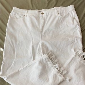 White crop jeans with tassels on the ankle